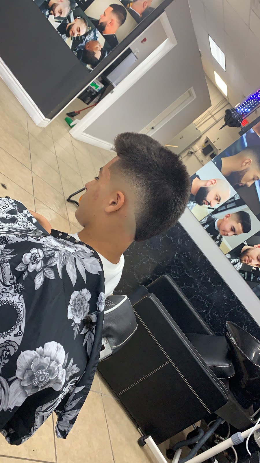 Burst fade mohawk cut at one of our stations